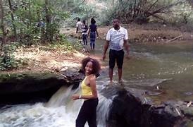 touring coulpe in ogbunike waterfall